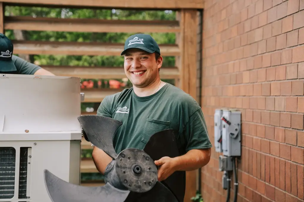IAT technician smiling during new installation